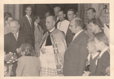 Konrad Adenauer (at left, behind the children) visiting St. Ludwig