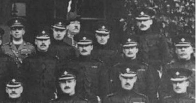 Portion of a 1922 photograph of the officers of the 1st Battalion, Irish Guards, taken at Aldershot in 1926. For this portion of the photograph, the third row caption has: Rev. J. McGuinness, Chaplain; 2/Lt Montagu-Douglas; Capt and Quartermaster H. Hicke MBE, MC; Lt. R.C. Alexander