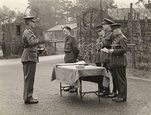 Regimental Sergeant Major presenting silver goblet/cup to Lt. Col. R.W.G. Stephens and two officers (Copyright 2021 Pete MacKean - used with permission).