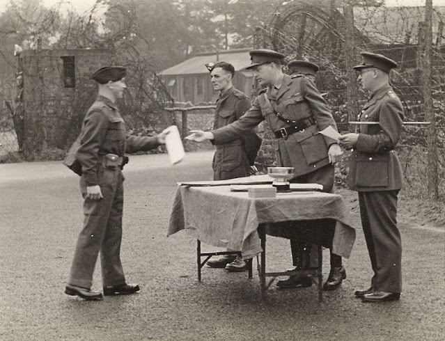 Soldier presenting an object to Lt. Col. R.W.G. Stephens (Copyright 2021 Pete MacKean - used with permission).