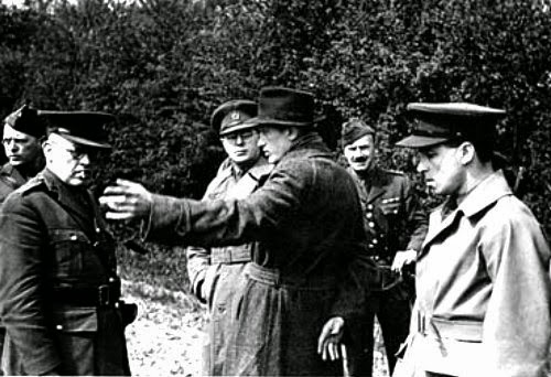 Camp 020 interrogators and German spy Karel Richter, 18 May 1941. (R.W.G. Stephens, G.F. Sampson, R.A.F. Short, Karel Richter, D.B. Stimson, E.B. Goodacre) (Imperial War Museum - HU 66766 - Fair Use)