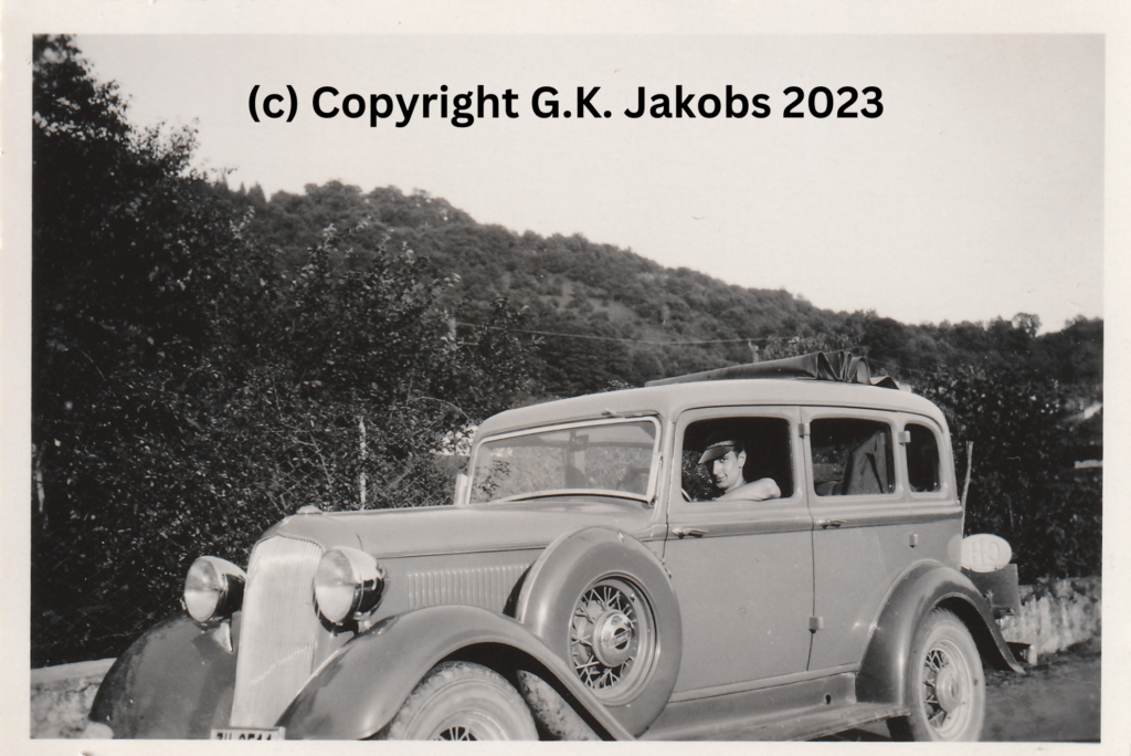 Mystery Man in the driver's seat of the vehicle used by Josef and Margarete Jakobs in July/August 1934. Location unknown. Copyright G.K. Jakobs 2023