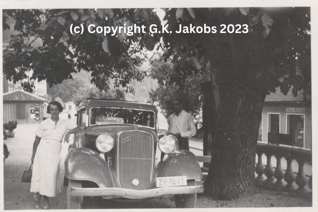 Margarete Jakobs and the Mystery Man stopped for a break next to the vehicle used by Josef and Margarete Jakobs in July/August 1934. Location unknown. Copyright G.K. Jakobs 2023.